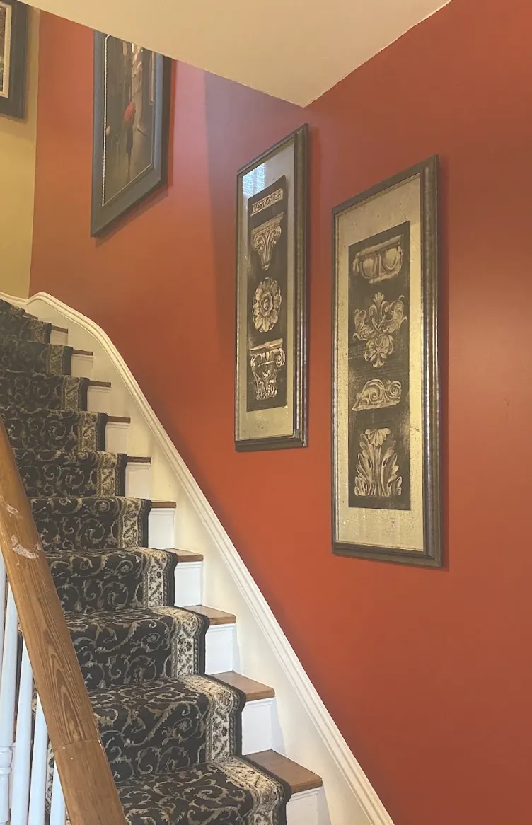 Interior stairwell freshly painted a bold brick red